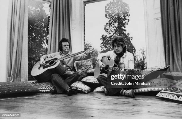 Scottish musician Jack Bruce and Mick Taylor, formerly of the Rolling Stones, at Bruce's home in Essex, UK, January 1975.