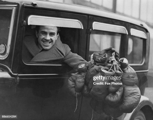 English boxer Jackie Brown , flyweight champion of the world, arrives for training in preparation for his fight at Belle Vue with Dave Crowley, 16th...