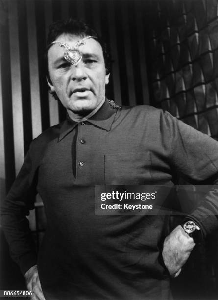 Welsh actor Richard Burton wearing the Taj Mahal diamond pendant which he gave to his wife, actress Elizabeth Taylor on her 40th birthday, March 1972.