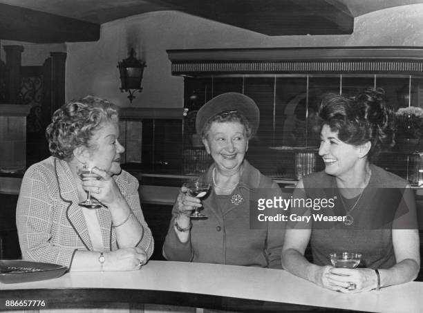 From left to right, 'Coronation Street' actresses Violet Carson , Margot Bryant and Pat Phoenix take a break during rehearsals for the 'Royal Gala'...