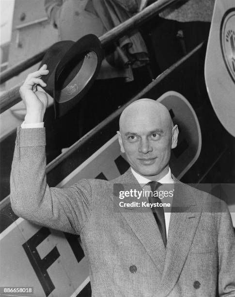 Russian-born actor Yul Brynner arrives at London Airport for the UK premiere of his film 'The Journey', 15th March 1959.