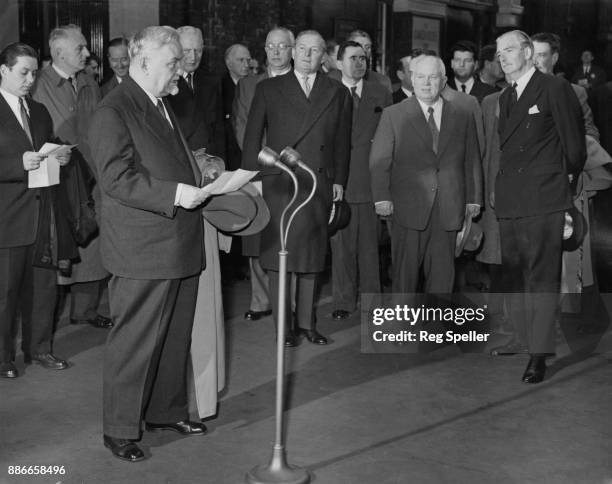 Russian leader Nikolai Bulganin makes his farewell speech in the presence of Nikita Khrushchev and British Prime Minister Anthony Eden before...