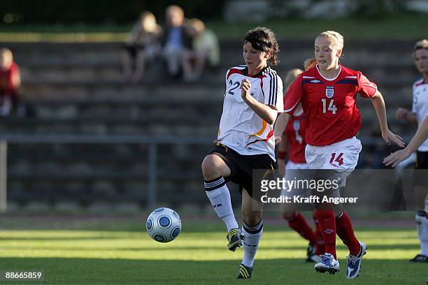 Sylvia Arnold of Germany is challenging for the ball with Abby Prosser of England during the U19 Women International Friendly match between Germany...