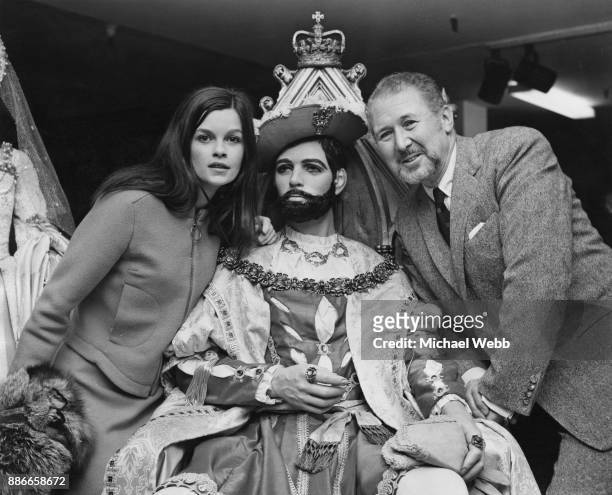 Canadian actress Geneviève Bujold and English actor Anthony Quayle attend an exhibition at Harrods in London of the costumes from the film 'Anne of...