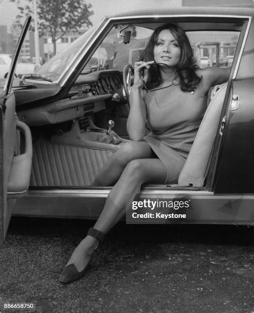Italian actress Maria Grazia Buccella gets into an Iso Grifo Italian sports car at London Airport, en route to the Dorchester Hotel, 25th September...