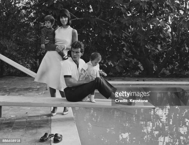 German actor Horst Buchholz and French actress Myriam Bru with their children Christopher and Beatrice at their rented villa on the Via Cassia in...