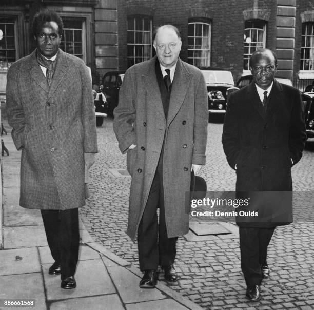 Conservative politician Rab Butler , the head of the Central African Office, arrives with Kenneth Kaunda and Harry Nkumbula , leaders of the Northern...