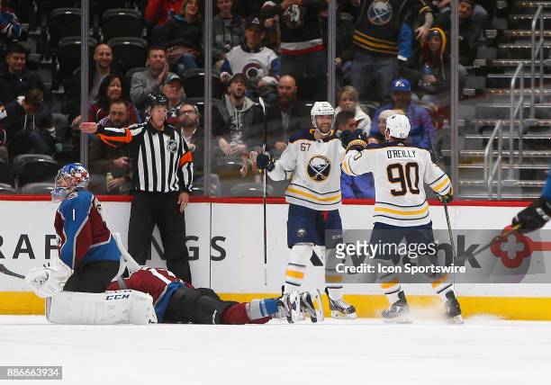 Buffalo Sabres center Ryan O'Reilly and Buffalo Sabres left wing Benoit Pouliot celebrate a goal by Pouliot during a regular season game between the...
