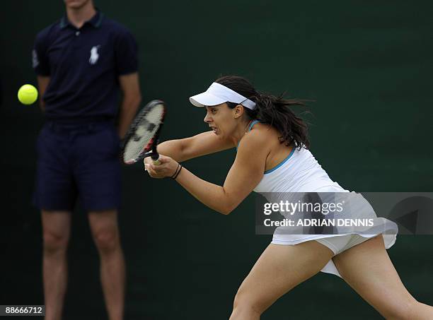 France's Marion Bartoli plays against Switzerland's Timea Bacsinszky at the All England Tennis Club on the third day of the Wimbledon Tennis...