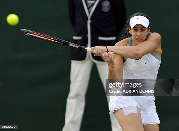 France's Marion Bartoli plays against Switzerland's Timea Bacsinszky at the All England Tennis Club on the third day of the Wimbledon Tennis...