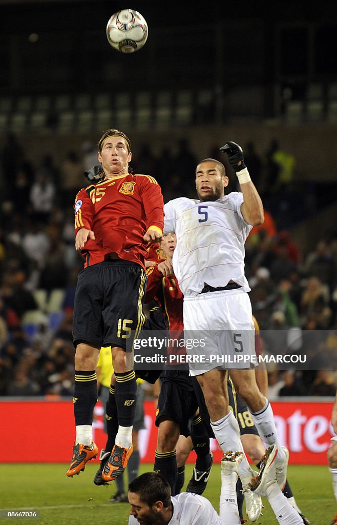 Spanish defender Sergio Ramos (L) fights