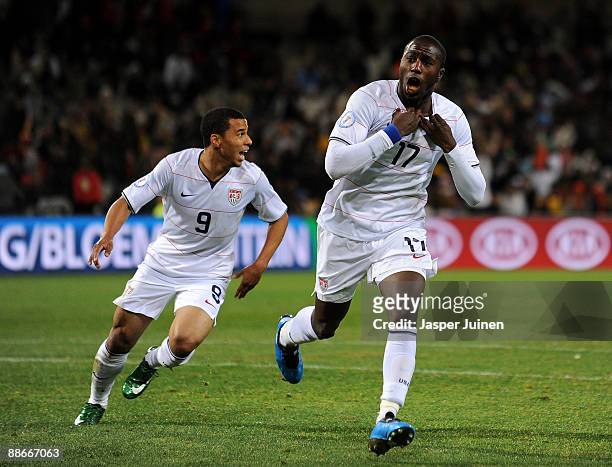 Jozy Altidore of USA celebrates scoring his sides opening goal with his teammate Charlie Davies during the FIFA Confederations Cup Semi Final match...