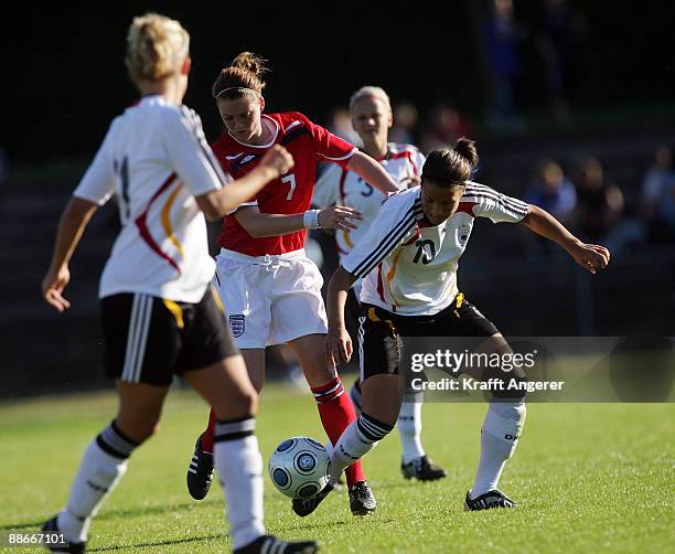 Dzsenifer Marozsan of Germany is challenging for the ball with Jade Moore of Englang during the U19 Women International Friendly match between...