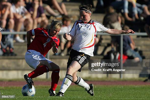 Marina Hegering of Germany is challenging for the ball with Remi Allen of England during the U19 Women International Friendly match between Germany...