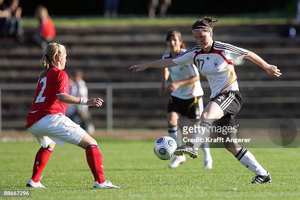 Marina Hegering of Germany is challenging for the ball with Laura Combes of England during the U19 Women International Friendly match between Germany...