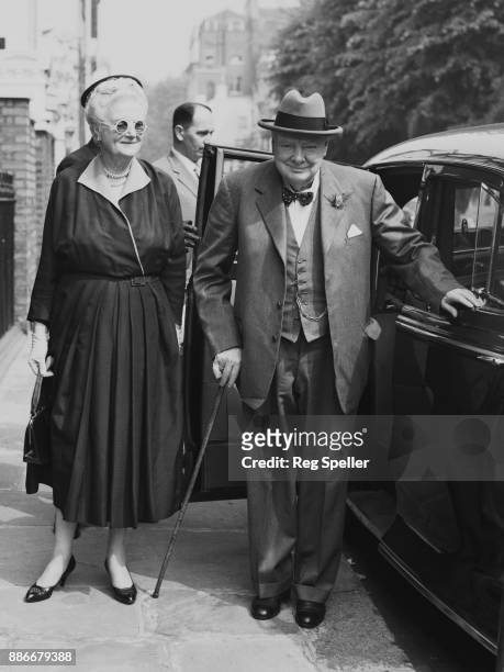 Former British Prime Minister Winston Churchill and his wife Clementine arrive home at Hyde Park Gate, London, having driven from the airport, 11th...
