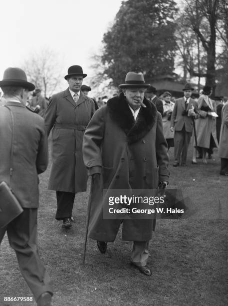 Former British Prime Minister Winston Churchill in the paddock at Sandown Park Racecourse, Surrey, UK, 27th April 1957. He has a runner on 'Le...