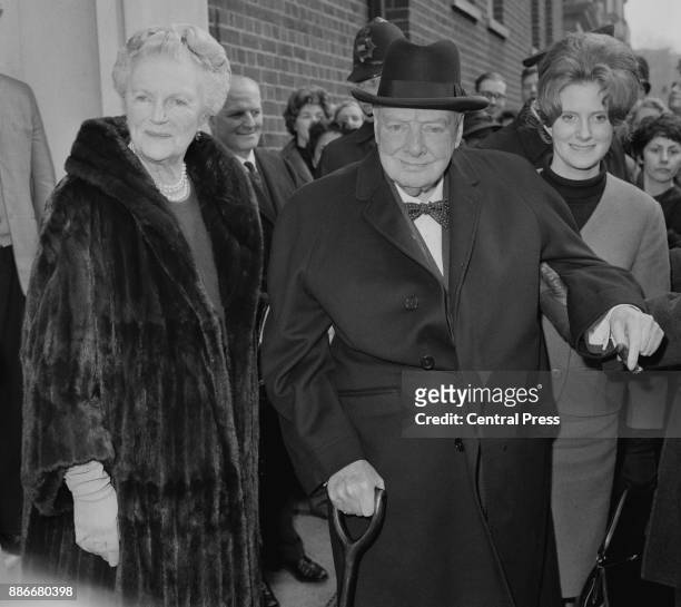 Former British Prime Minister Winston Churchill and his wife Clementine leave their daughter Mary's flat in Westminster, London, after a family lunch...