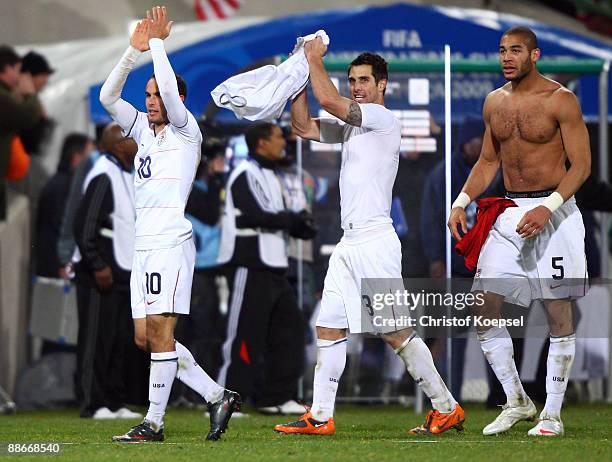Landon Donovan, Carlos Bocanegra and Oguchi Onyewu of the USA celebrate the 2-0 victory after the FIFA Confederations Cup Semi Final match between...