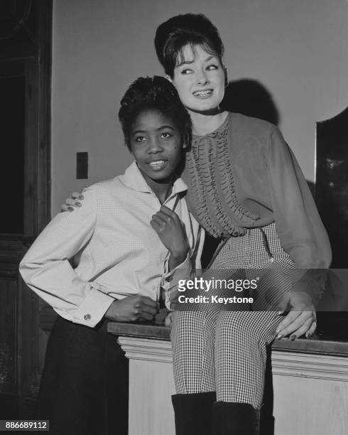 Jamaican ska singer Millie Small with English singer, Glenda Collins, London, UK, 9th March 1964. They are two of the performers in 'Surprise Beat...