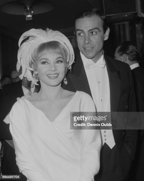 Scottish actor Sean Connery and his wife, actress Diane Cilento arrive at the Royal Film Performance of 'Lord Jim' at the Odeon Theatre, London, 15th...
