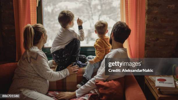joy of the first snow - family rear view stock pictures, royalty-free photos & images