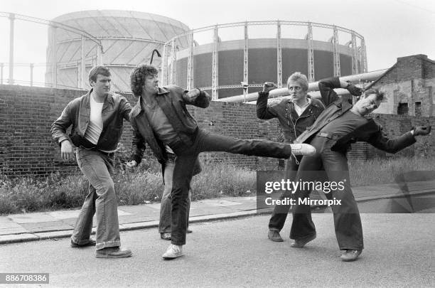 Martin Shaw and Lewis Collins wrestling with the bad guys on the set of the television Detective series The Professionals. June 1979.