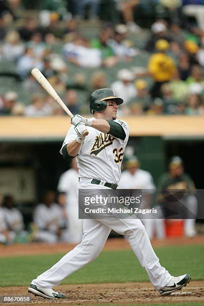 Jack Cust of the Oakland Athletics swings at a pitch during the game against the Minnesota Twins at the Oakland Coliseum on June 11, 2009 in Oakland,...