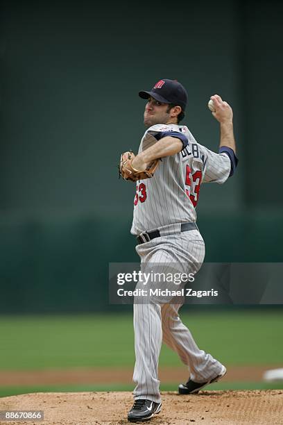 Nick Blackburn of the Minnesota Twins pitches during the game against the Oakland Athletics at the Oakland Coliseum on June 11, 2009 in Oakland,...