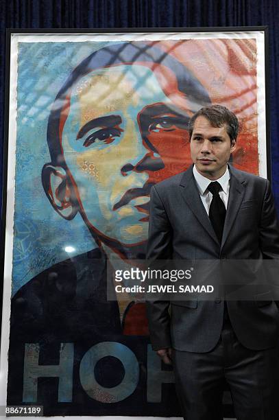 This January 17, 2009 file photo shows artist Shepard Fairey unveiling his portrait of then US president-elect Barack Obama before it was installed...