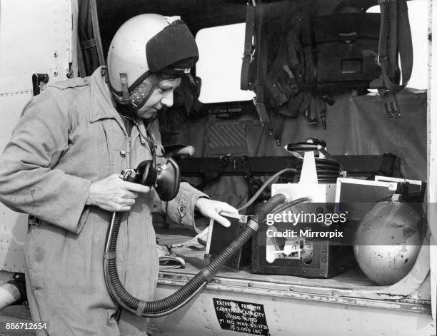 Navigator Steve Cawthorne of 202 Search and Rescue Squadron checks over the oxygen, which automatically adjusts its supply to meet the needs of the...