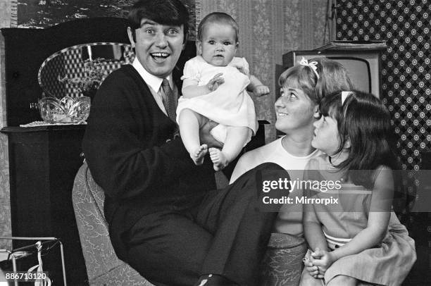 Jimmy Tarbuck in Great Yarmouth with his wife Pauline and their daughters Cheryl and Liza, 7 months. Jimmy didn't know for sure at 4pm if he was...