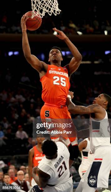 Tyus Battle of the Syracuse Orange takes a shot against Mamadou Diarra of the Connecticut Huskies in the second half during their game at Madison...