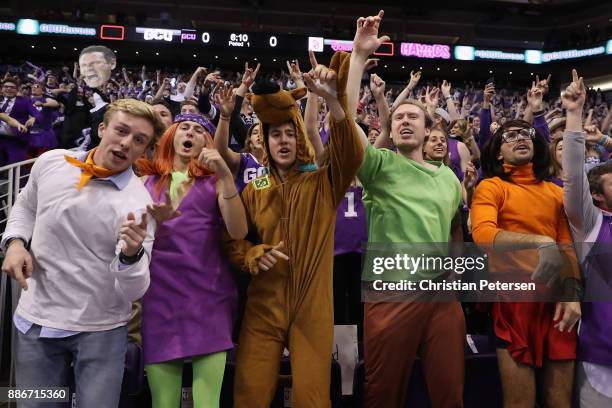 Fans of the Grand Canyon Antelopes, dressed as charactors from "scooby doo", cheer during the first half of the college basketball game against the...
