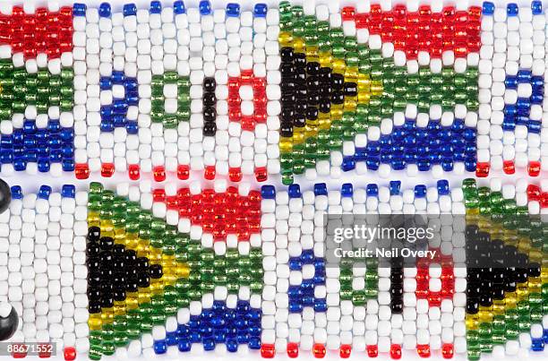 close up shot of beaded south african flag and 2010 world cup bracelets, grahamstown, eastern cape province, south africa - beaded bracelet stock pictures, royalty-free photos & images