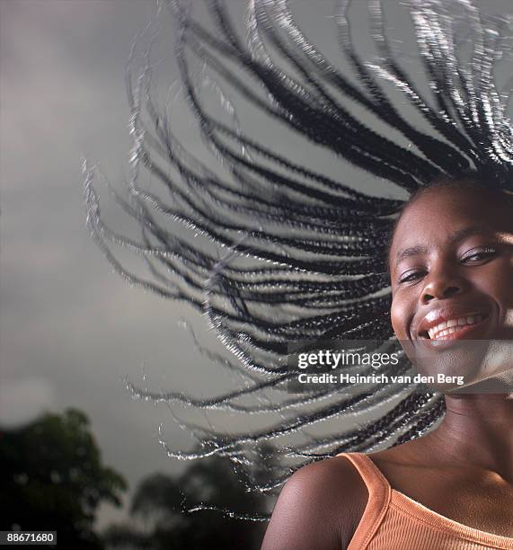 woman with dreadlocks, shaking head around, pietermaritzburg, kwazulu-natal province, south africa - freek van den bergh stock pictures, royalty-free photos & images