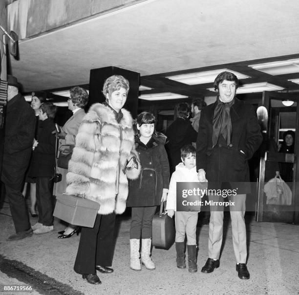 Jimmy Tarbuck sees off his wife Pauline and daughters Liza and Cheryl who were leaving Heathrow for a holiday in Austria, 21st February 1969.