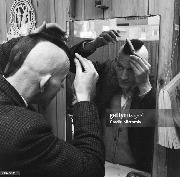 Man having a Mohican haircut in Middlesbrough. Circa 1971.