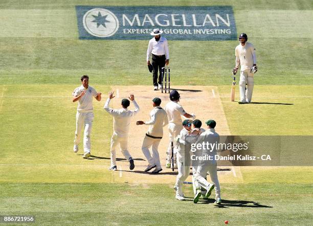 Mitchell Starc of Australia celebrates with his team mates after bowling out Jonny Bairstow of England to win the match for Australia during day five...