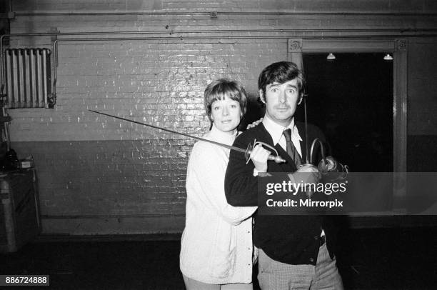 Maggie Smith in the title role of Peter Pan with Dave Allen as Captain Hook. Pictured together during rehearsals, 30th November 1973.