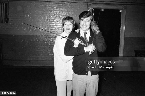 Maggie Smith in the title role of Peter Pan with Dave Allen as Captain Hook. Pictured together during rehearsals, 30th November 1973.