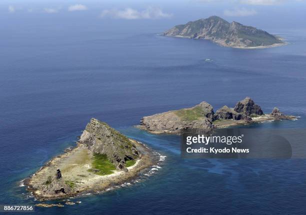 File photo taken in September 2012 shows the Senkaku Islands in the East China Sea. Japan and China have reached a broad accord on setting up a...