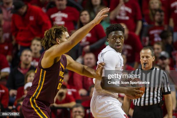 Nebraska center Jordy Tshimanga leans on Minnesota center Reggie Lynch before making a move to the basket during the second half Tuesday, December...