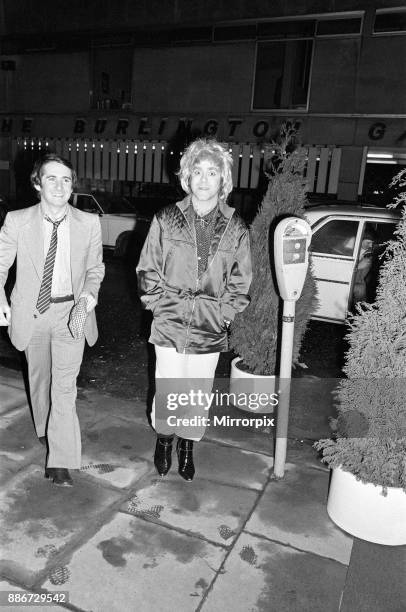 Elton John wearing a woman's wig, pictured with his manager John Reid, seen arriving at a party to celebrate his London show at Legends Club, 3rd...