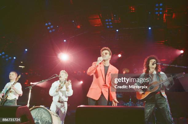 George Michael and the 3 remaining members of Queen perform the song '39' at The Freddie Mercury Tribute concert at Wembley Stadium in 1992. Picture...