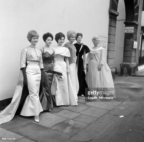 Six actresses line up at Cornwall Gardens, Kensington for a fitting and a photo call. They are wearing the gowns which have been designed by Alan...