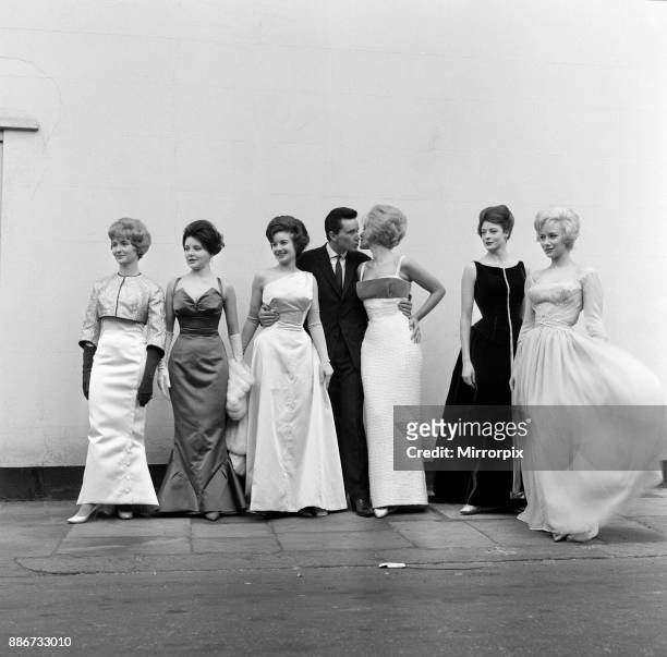 Six actresses line up at Cornwall Gardens, Kensington for a fitting and a photo call. They are wearing the gowns which have been designed by Alan...