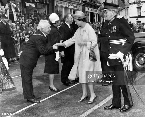 Queen Elizabeth II and the Duke of Edinburgh visit Wales. A bow from the Chairman of the Breconshire County Council, at the Fountain, Crickhowell. On...