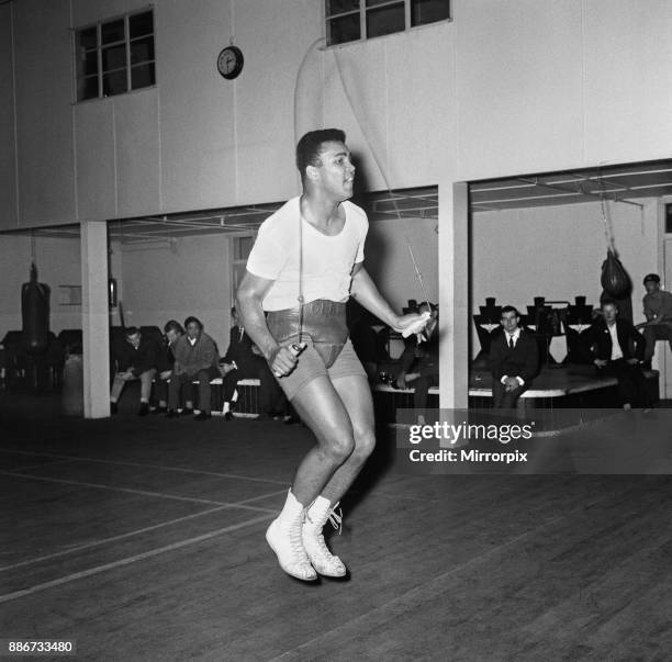 American boxing legend Muhammad Ali, formerly Cassius Clay, use a skipping rope during a training session before his non-title heavyweight fight...