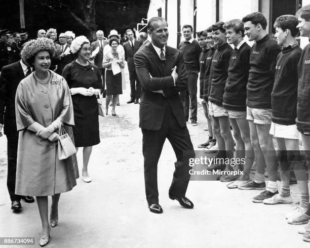 Happy smile from the Queen and the Duke for some of the boys at the Outward Bound School for Boys at Aberdovey, 10th August 1963.